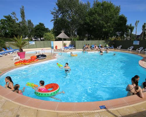 Heated swimming pool at Les Genêts campsite in Brittany