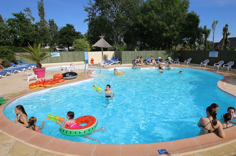 Heated swimming pool at Les Genêts campsite in Brittany